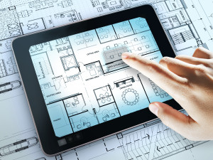 touch screen computer shows interior layout plan of office business